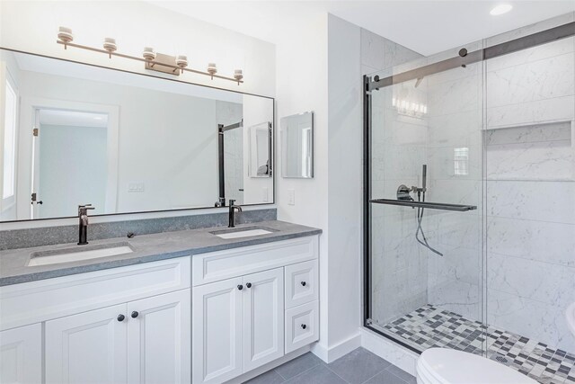 130 Sunset Ln, Greenport, NY 11944 - bathroom with a stall shower, tile patterned floors, and double vanity