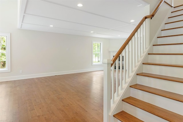 130 Sunset Ln, Greenport, NY 11944 - staircase featuring wood finished floors and recessed lighting