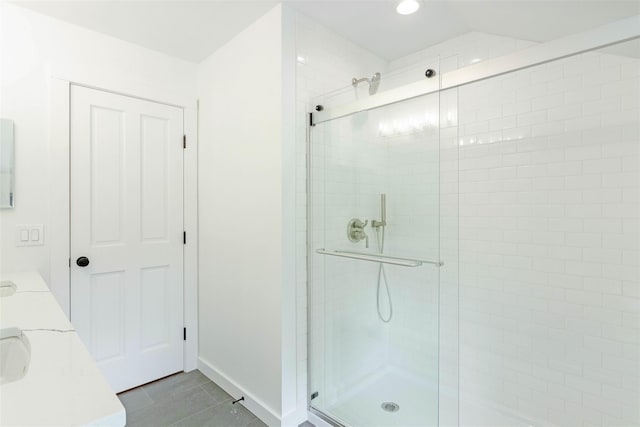 130 Sunset Ln, Greenport, NY 11944 - bathroom featuring a stall shower, double vanity, and recessed lighting