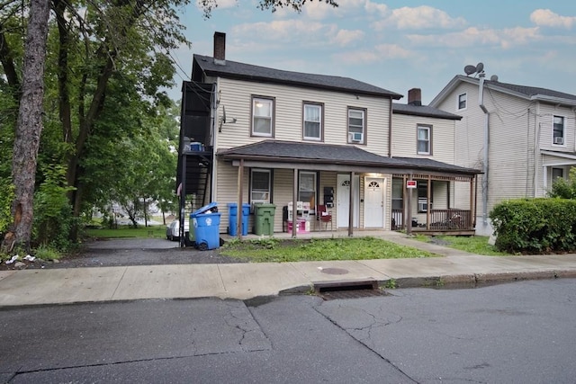 11 E Ave, Middletown, NY 10940 - view of property with a chimney and a porch