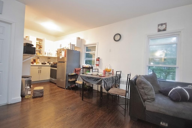 11 E Ave, Middletown, NY 10940 - kitchen with appliances with stainless steel finishes, dark wood finished floors, light countertops, under cabinet range hood, and open shelves