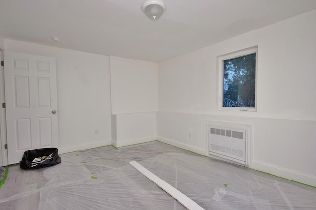 11 E Ave, Middletown, NY 10940 - empty room with radiator and baseboards