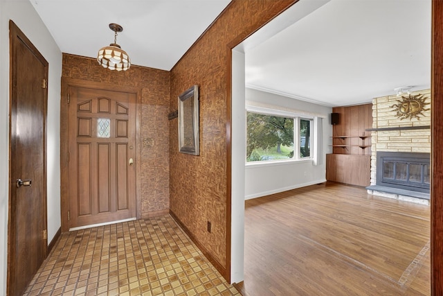 25 Tappan Ter, Briarcliff Manor, NY 10510 - foyer entrance with a stone fireplace and wood finished floors
