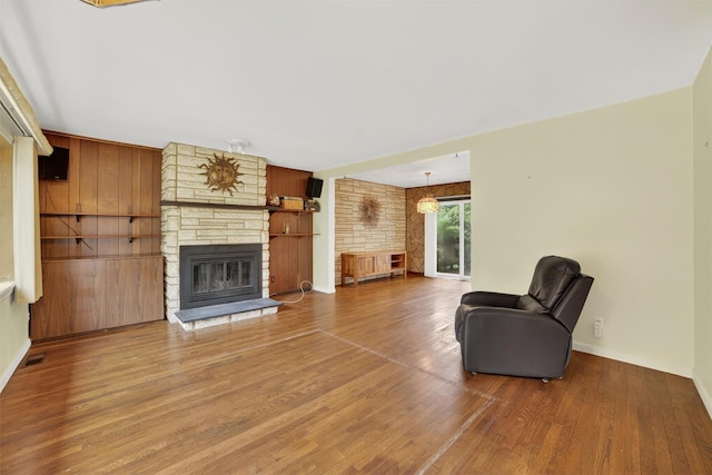 25 Tappan Ter, Briarcliff Manor, NY 10510 - living room featuring a stone fireplace and wood finished floors