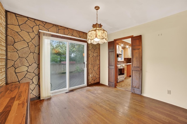 25 Tappan Ter, Briarcliff Manor, NY 10510 - unfurnished dining area with light wood-style flooring and a chandelier