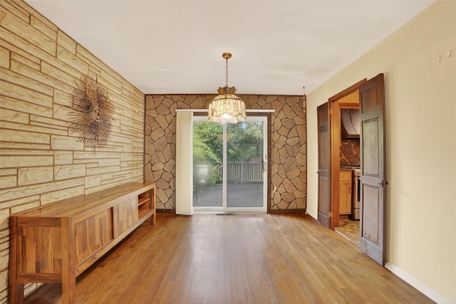 25 Tappan Ter, Briarcliff Manor, NY 10510 - unfurnished dining area with light wood-style floors and a chandelier