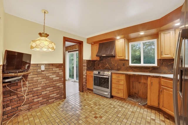 25 Tappan Ter, Briarcliff Manor, NY 10510 - kitchen featuring wall chimney exhaust hood, stainless steel gas range oven, brick wall, decorative light fixtures, and crown molding
