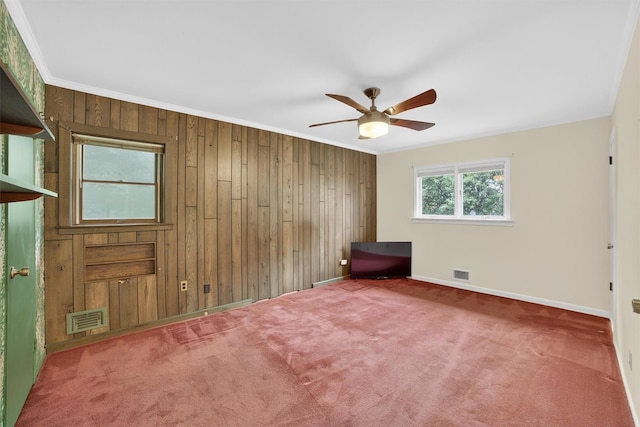 25 Tappan Ter, Briarcliff Manor, NY 10510 - carpeted empty room featuring wooden walls, a ceiling fan, and ornamental molding