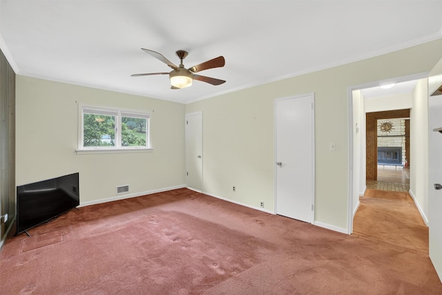 25 Tappan Ter, Briarcliff Manor, NY 10510 - unfurnished bedroom with carpet flooring, ornamental molding, a stone fireplace, and a ceiling fan