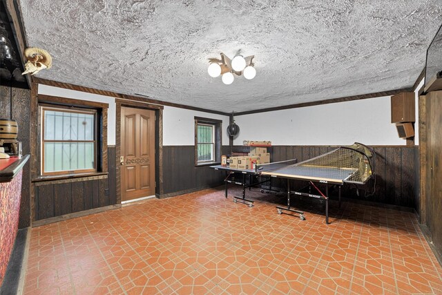 25 Tappan Ter, Briarcliff Manor, NY 10510 - recreation room with wainscoting, wooden walls, and a textured ceiling