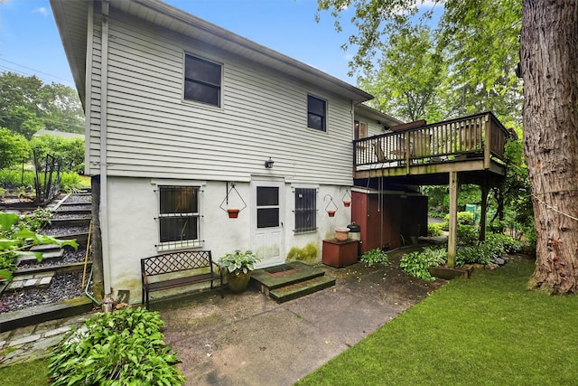 25 Tappan Ter, Briarcliff Manor, NY 10510 - rear view of house featuring a wooden deck, entry steps, a yard, and stucco siding