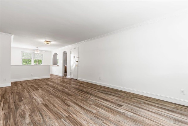 24 Ridge St N Unit 24-A, Rye Brook, NY 10573 - spare room featuring wood finished floors, a ceiling fan, arched walkways, and crown molding