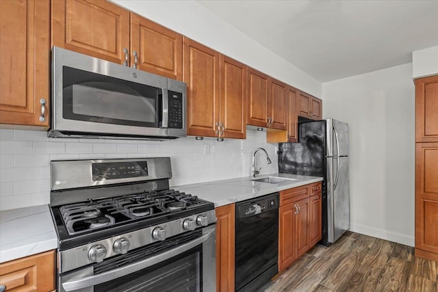 24 Ridge St N Unit 24-A, Rye Brook, NY 10573 - kitchen featuring appliances with stainless steel finishes, dark wood-style flooring, light countertops, and brown cabinets