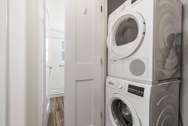 24 Ridge St N Unit 24-A, Rye Brook, NY 10573 - laundry area with estacked washer and dryer and wood finished floors