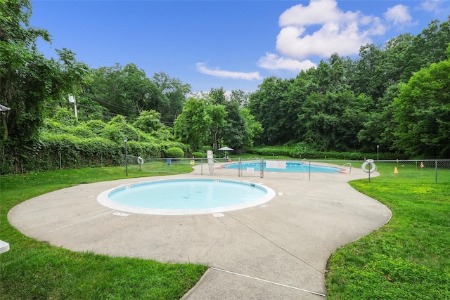 24 Ridge St N Unit 24-A, Rye Brook, NY 10573 - community pool with a patio area and view of wooded area