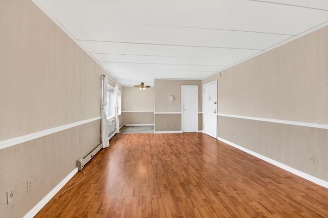 2035 Central Park Ave Unit 3M, Yonkers, NY 10710 - empty room featuring a baseboard heating unit and wood finished floors