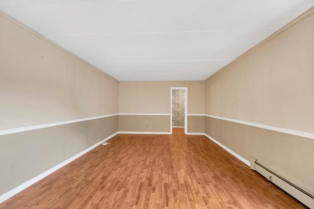 2035 Central Park Ave Unit 3M, Yonkers, NY 10710 - empty room featuring a baseboard radiator and light wood-style flooring