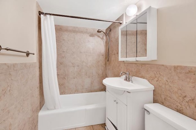 2035 Central Park Ave Unit 3M, Yonkers, NY 10710 - full bathroom featuring tile walls, shower / bath combination with curtain, vanity, tile patterned floors, and wainscoting