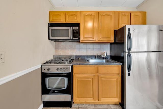 2035 Central Park Ave Unit 3M, Yonkers, NY 10710 - kitchen featuring appliances with stainless steel finishes, tasteful backsplash, and dark countertops