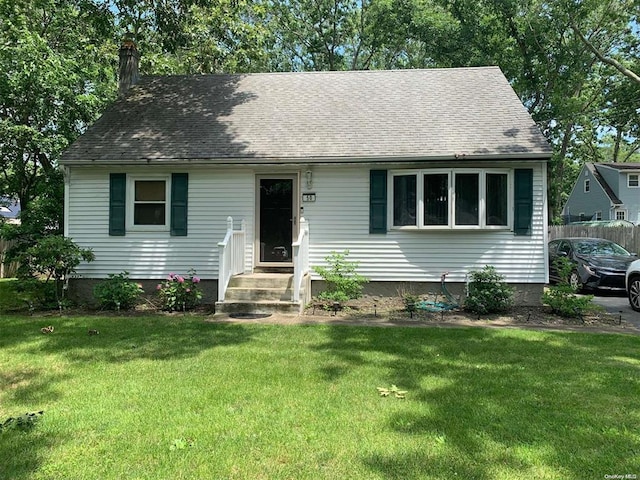 50 Oakland Dr, Riverhead, NY 11901 - view of front facade featuring entry steps, a chimney, and a shingled roof
