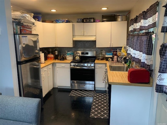 50 Oakland Dr, Riverhead, NY 11901 - kitchen featuring stainless steel appliances, under cabinet range hood, light countertops, tasteful backsplash, and white cabinets