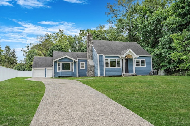 6 Youngs Ln, Setauket, NY 11733 - view of front of home with a chimney, a detached garage, and roof with shingles