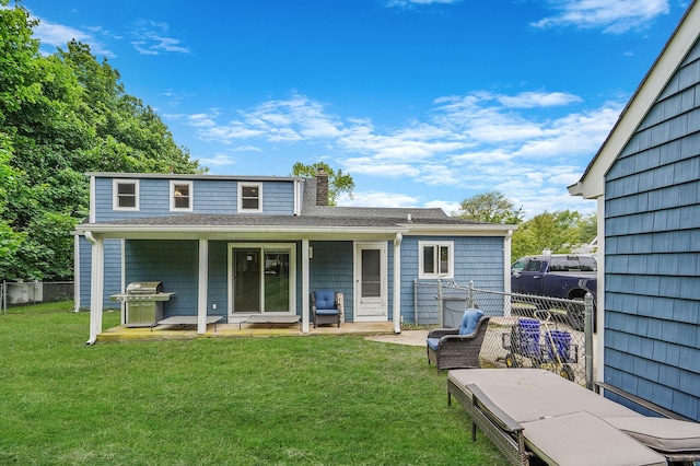6 Youngs Ln, Setauket, NY 11733 - back of property with a chimney, a patio, and roof with shingles