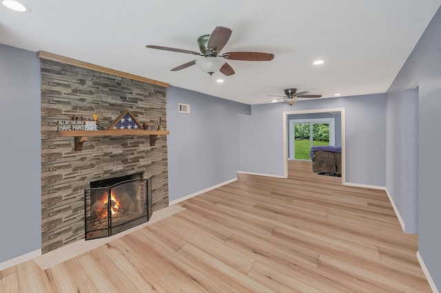 6 Youngs Ln, Setauket, NY 11733 - unfurnished living room with a ceiling fan, wood finished floors, a fireplace, and recessed lighting