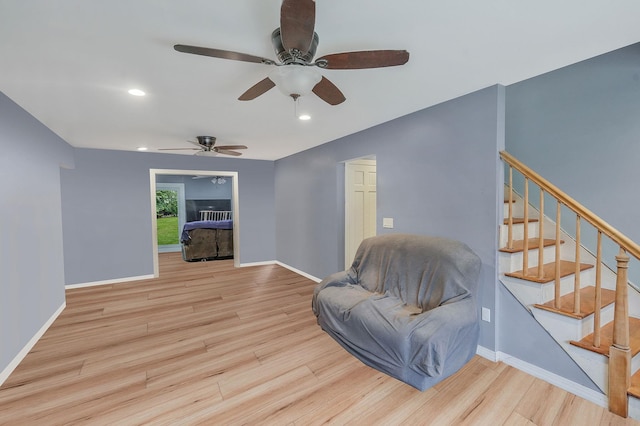 6 Youngs Ln, Setauket, NY 11733 - sitting room featuring a ceiling fan, wood finished floors, stairway, and recessed lighting