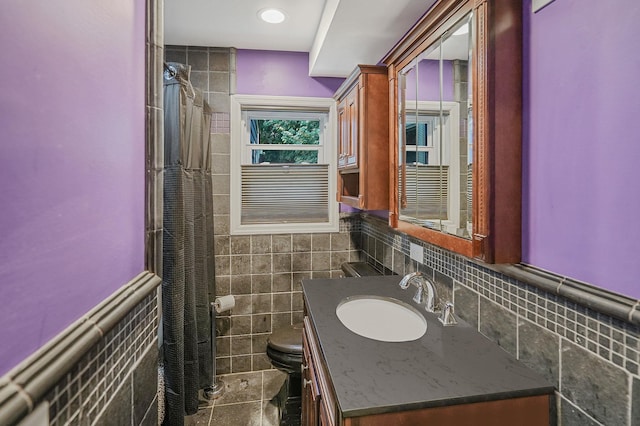 6 Youngs Ln, Setauket, NY 11733 - bathroom with tile walls, vanity, a wainscoted wall, and curtained shower