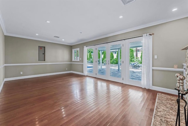 709 Demott Ct, Westbury, NY 11590 - unfurnished living room featuring wood finished floors, crown molding, french doors, electric panel, and recessed lighting