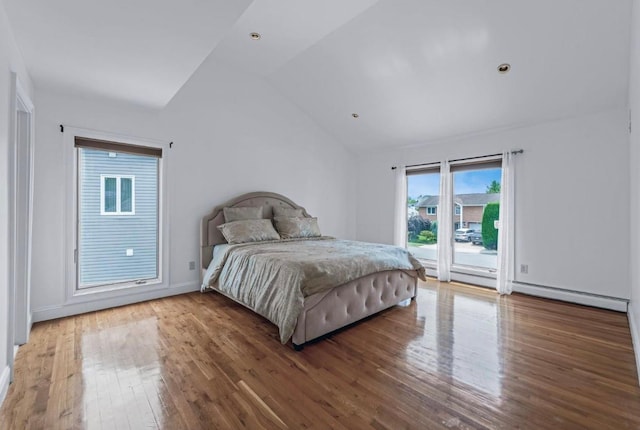 709 Demott Ct, Westbury, NY 11590 - bedroom featuring lofted ceiling, wood finished floors, and access to exterior