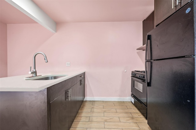 41-38 College Point Blvd Unit 4A, Flushing, NY 11355 - kitchen featuring black appliances, a peninsula, light countertops, dark brown cabinets, and modern cabinets