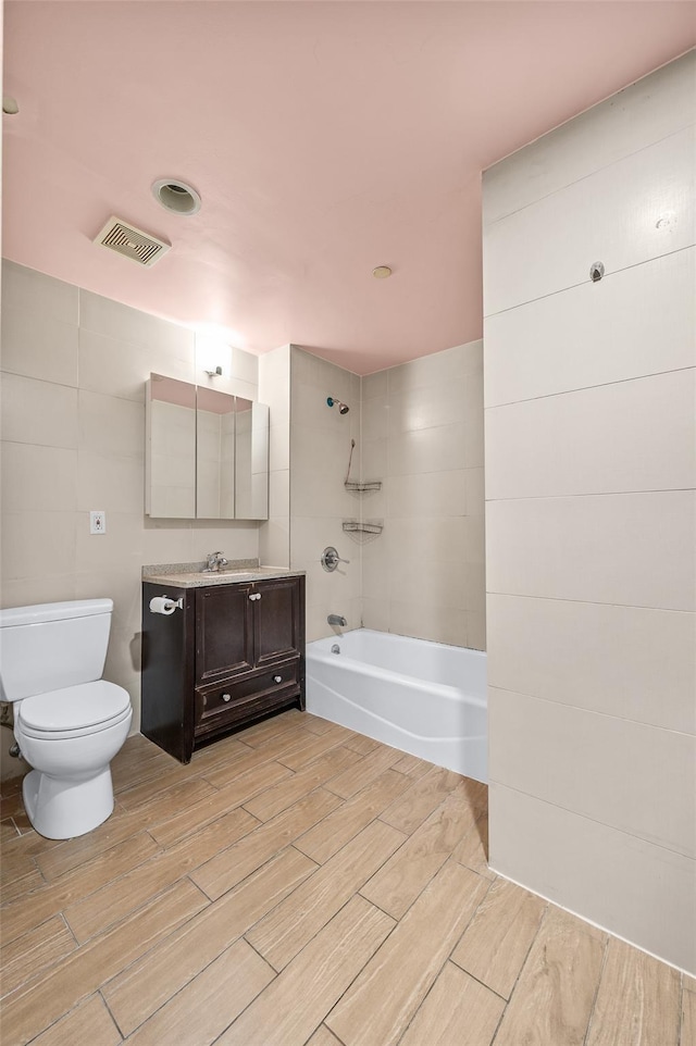 41-38 College Point Blvd Unit 4A, Flushing, NY 11355 - bathroom featuring wood finish floors, vanity, and tub / shower combination