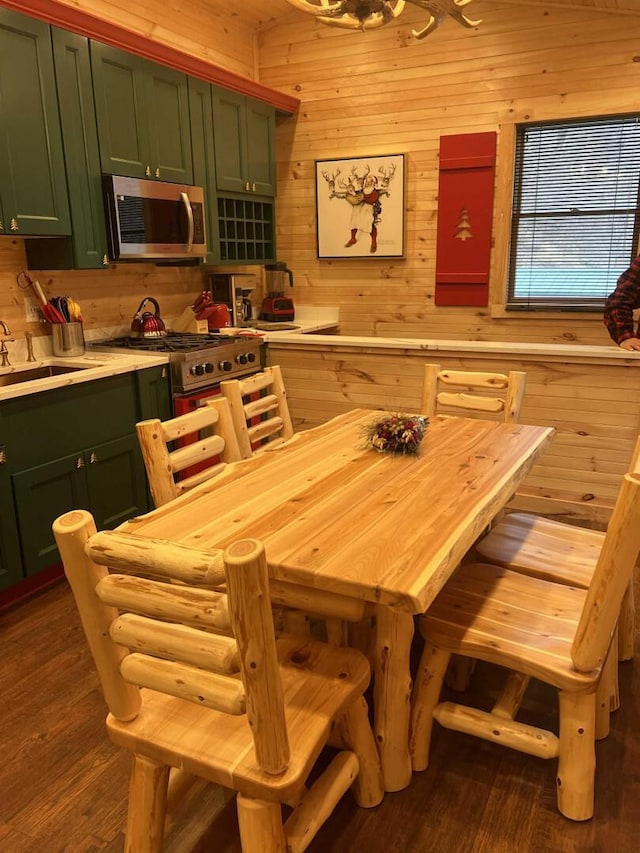 989 Chiloway Rd, Roscoe, NY 13856 - dining room featuring wood walls and dark wood finished floors