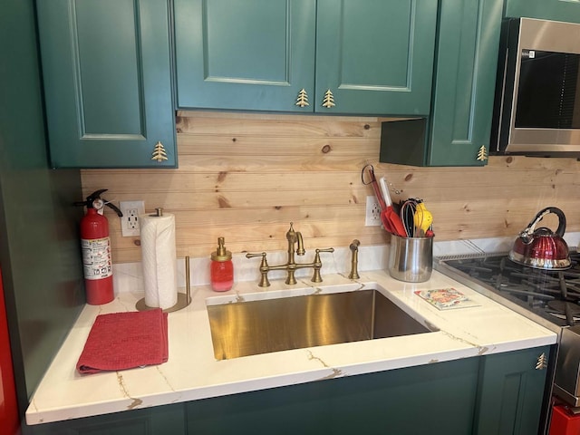 989 Chiloway Rd, Roscoe, NY 13856 - kitchen with stainless steel microwave, stove, and green cabinets