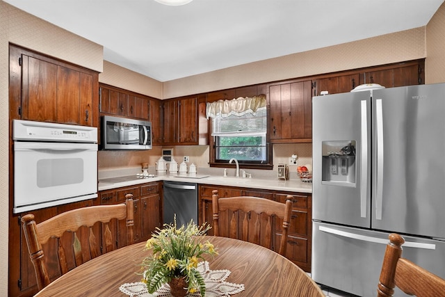 127 Bullet Hole Rd, Carmel, NY 10512 - kitchen with appliances with stainless steel finishes and light countertops