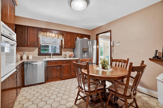 127 Bullet Hole Rd, Carmel, NY 10512 - kitchen with dishwasher, fridge with ice dispenser, oven, and light countertops