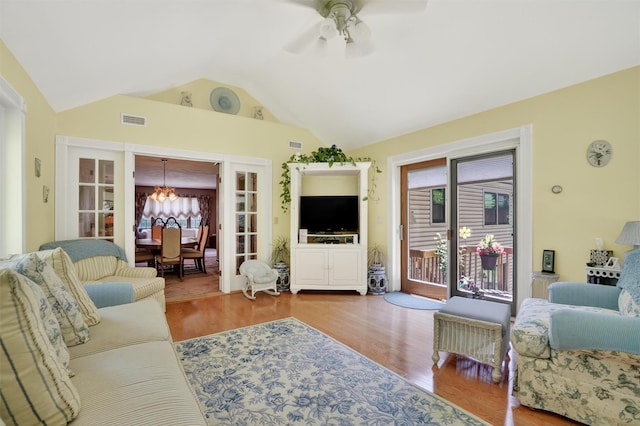 127 Bullet Hole Rd, Carmel, NY 10512 - living area with a chandelier, vaulted ceiling, plenty of natural light, wood finished floors, and a ceiling fan