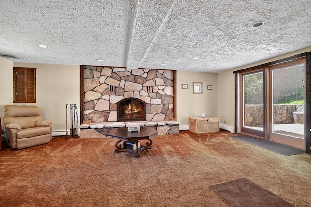 127 Bullet Hole Rd, Carmel, NY 10512 - carpeted living room with a stone fireplace, a baseboard radiator, a textured ceiling, and recessed lighting