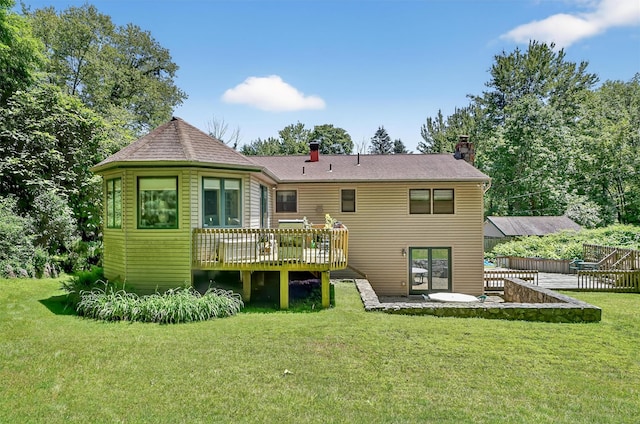 127 Bullet Hole Rd, Carmel, NY 10512 - rear view of house with a deck, a chimney, and a yard