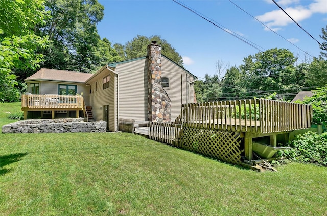 127 Bullet Hole Rd, Carmel, NY 10512 - rear view of property featuring a deck, a lawn, and a chimney