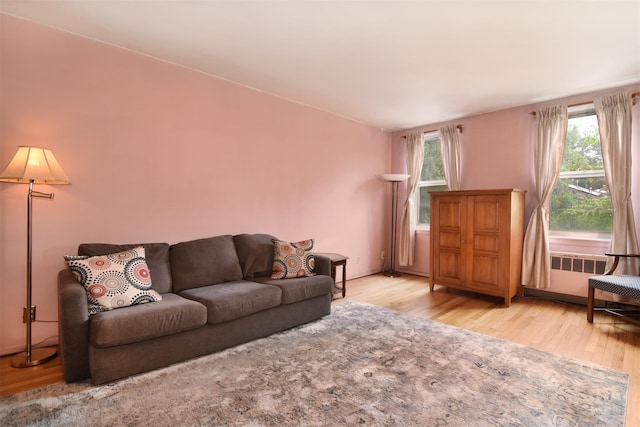 1 Georgia Ave Unit 3E, Bronxville, NY 10708 - living room featuring radiator and wood finished floors