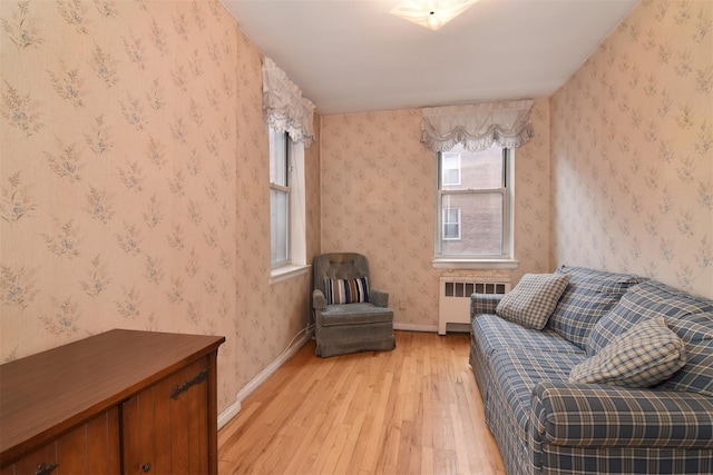 1 Georgia Ave Unit 3E, Bronxville, NY 10708 - sitting room featuring radiator, light wood-style floors, and wallpapered walls