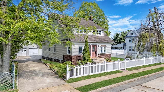 26 Rosedale Ave, Freeport, NY 11520 - view of front facade with a fenced front yard and a shingled roof