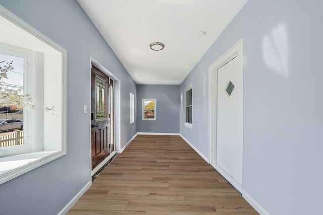 26 Rosedale Ave, Freeport, NY 11520 - hallway with light wood finished floors and baseboards