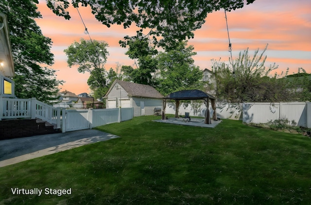 26 Rosedale Ave, Freeport, NY 11520 - yard at dusk featuring a gazebo, a patio area, a fenced backyard, and a gate