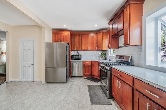 26 Rosedale Ave, Freeport, NY 11520 - kitchen featuring stainless steel appliances, light countertops, tasteful backsplash, recessed lighting, and radiator heating unit