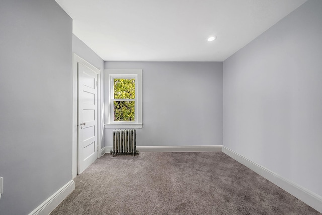 26 Rosedale Ave, Freeport, NY 11520 - carpeted empty room featuring radiator heating unit and recessed lighting