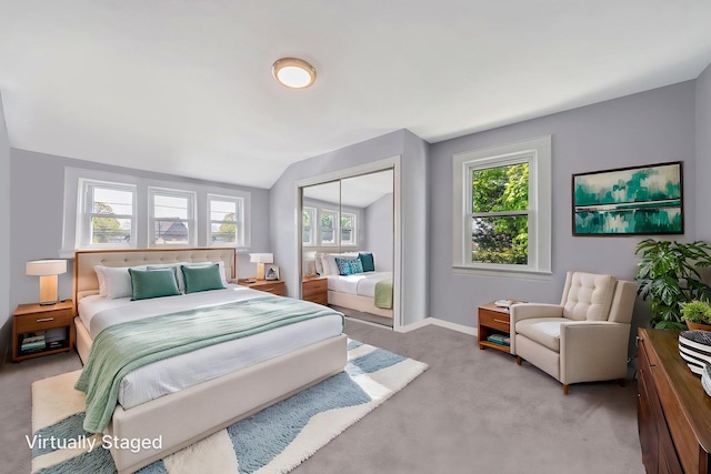 26 Rosedale Ave, Freeport, NY 11520 - bedroom featuring carpet floors, vaulted ceiling, multiple windows, and a closet